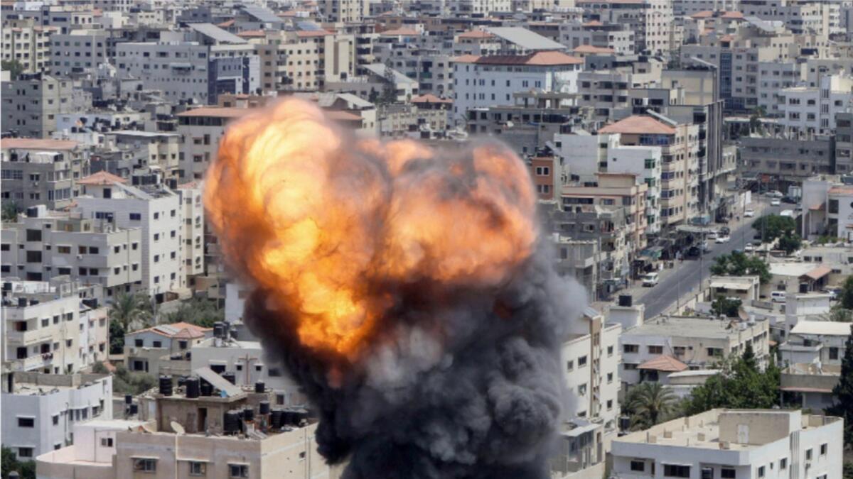 Flame and smoke rise during an Israeli air strike, amid Israel-Gaza fighting, in Gaza City. — Reuters