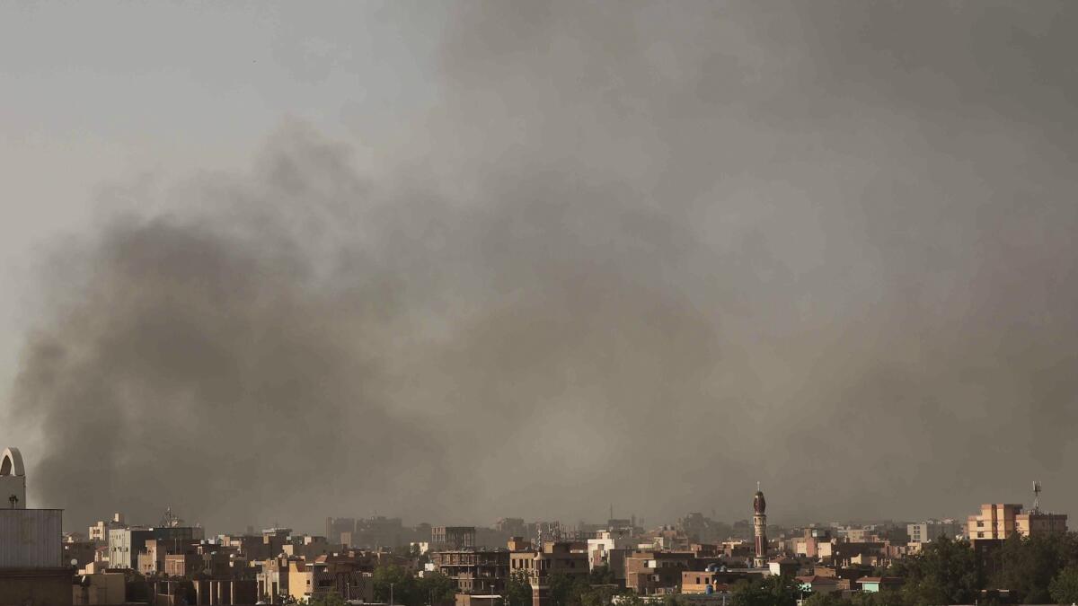 Smoke rises in Khartoum, Sudan, as gunfire and heavy artillery fire continued on Sunday. — AP
