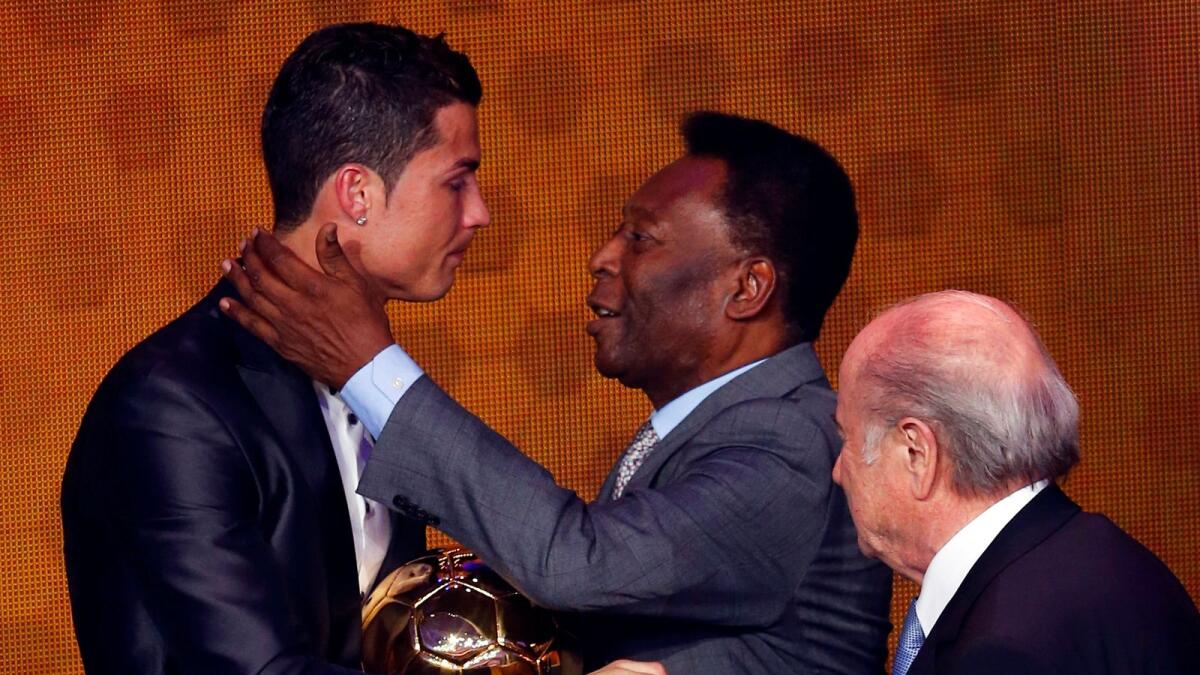 Portugal's Cristiano Ronaldo is congratulated by Pele after being awarded the Fifa Ballon d'Or 2013 in Zurich January 13, 2014. — Reuters file