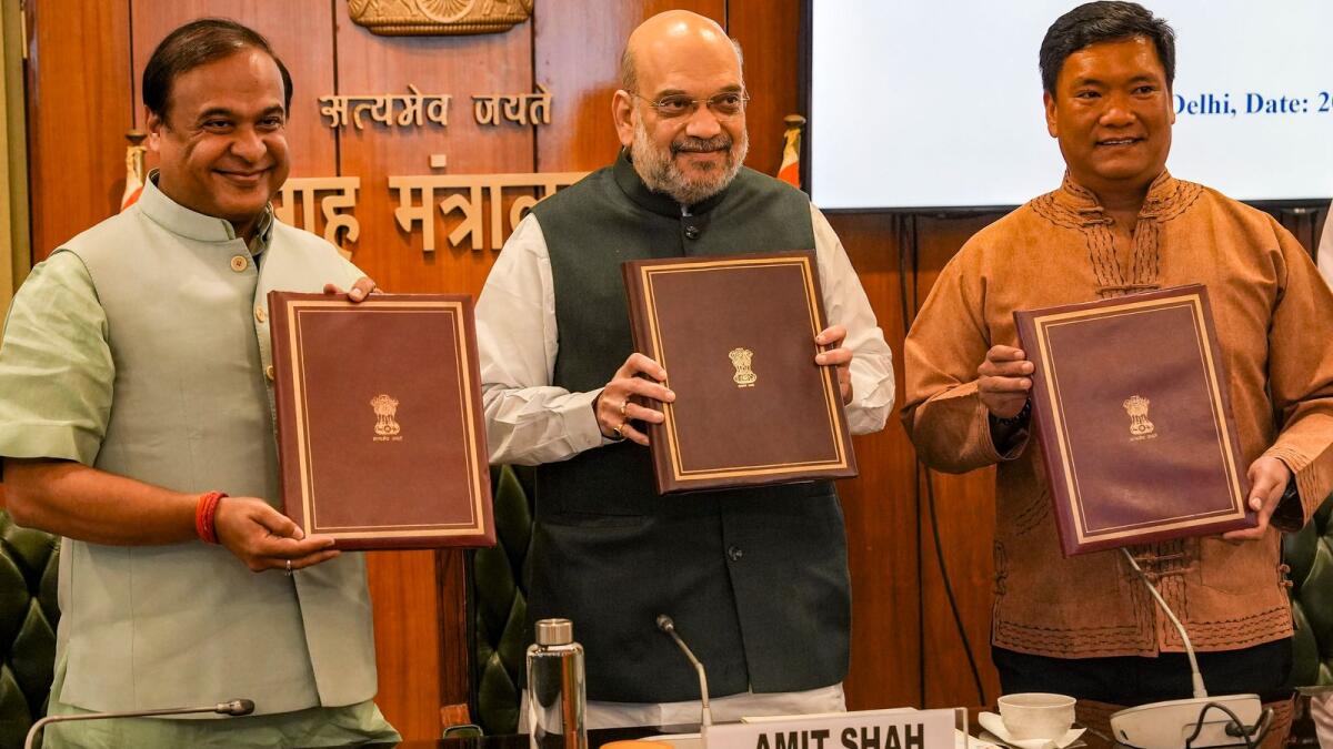 Union Home Minister Amit Shah with Assam Chief Minister Himanta Biswa Sarma (left) and Arunachal Pradesh CM Pema Khandu during signing of the boundary agreement between the two states in New Delhi on Thursday. — PTI