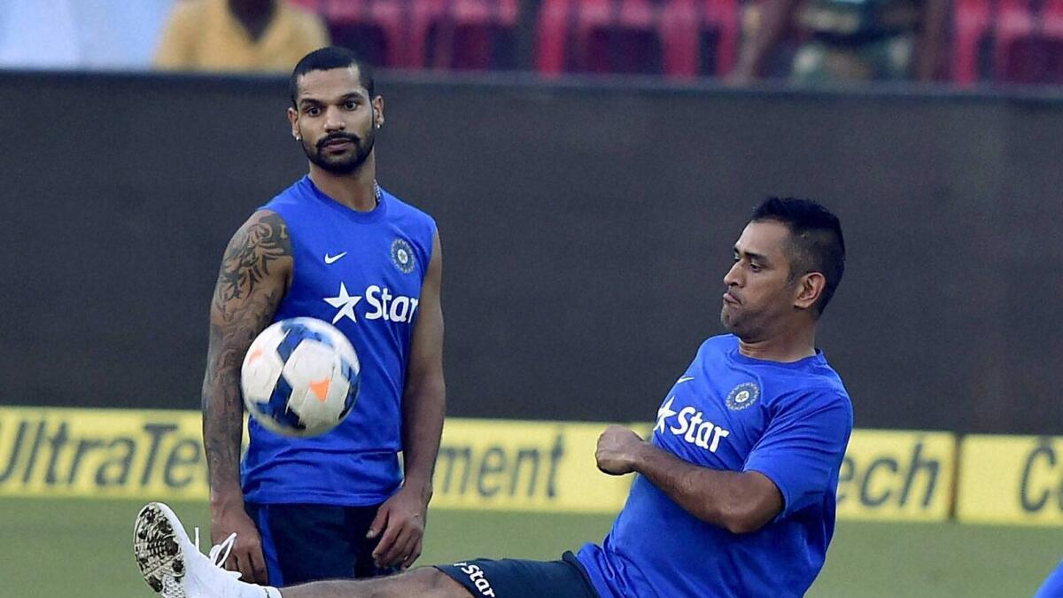 Cuttack:Indian Captain M.S.Dhoni playing soccer with his teammates during their training session prior to the 2nd T20 Match against South Africa at Barabati Stadium in Cuttack on Sunday.PTI Photo by Swapan Mahapatra(PTI10_4_2015_000162a)
