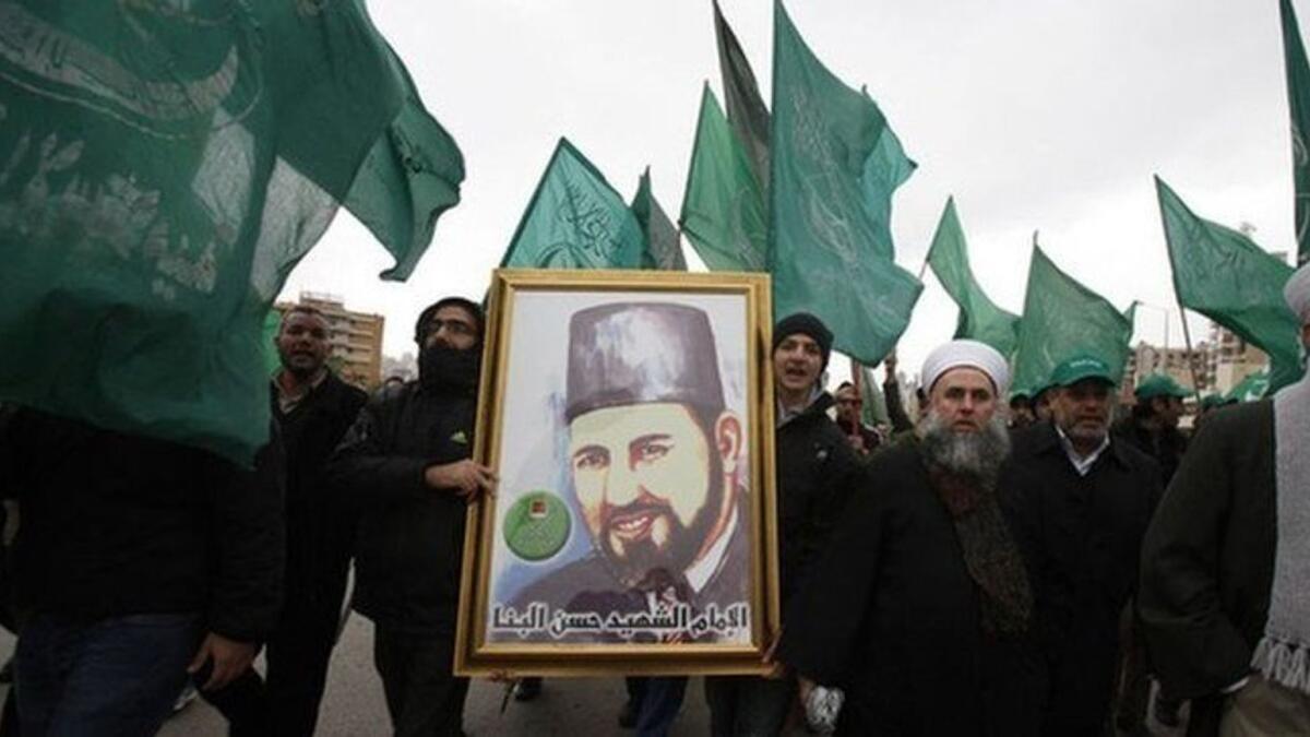 Protesters carry a picture of Hassan Al-Banna, the Muslim Brotherhood founder, in Beirut in this file photo.