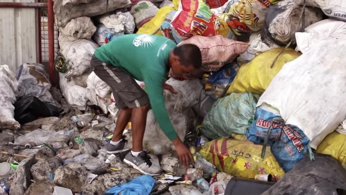 Video: Man collects garbage, sends daughter to university