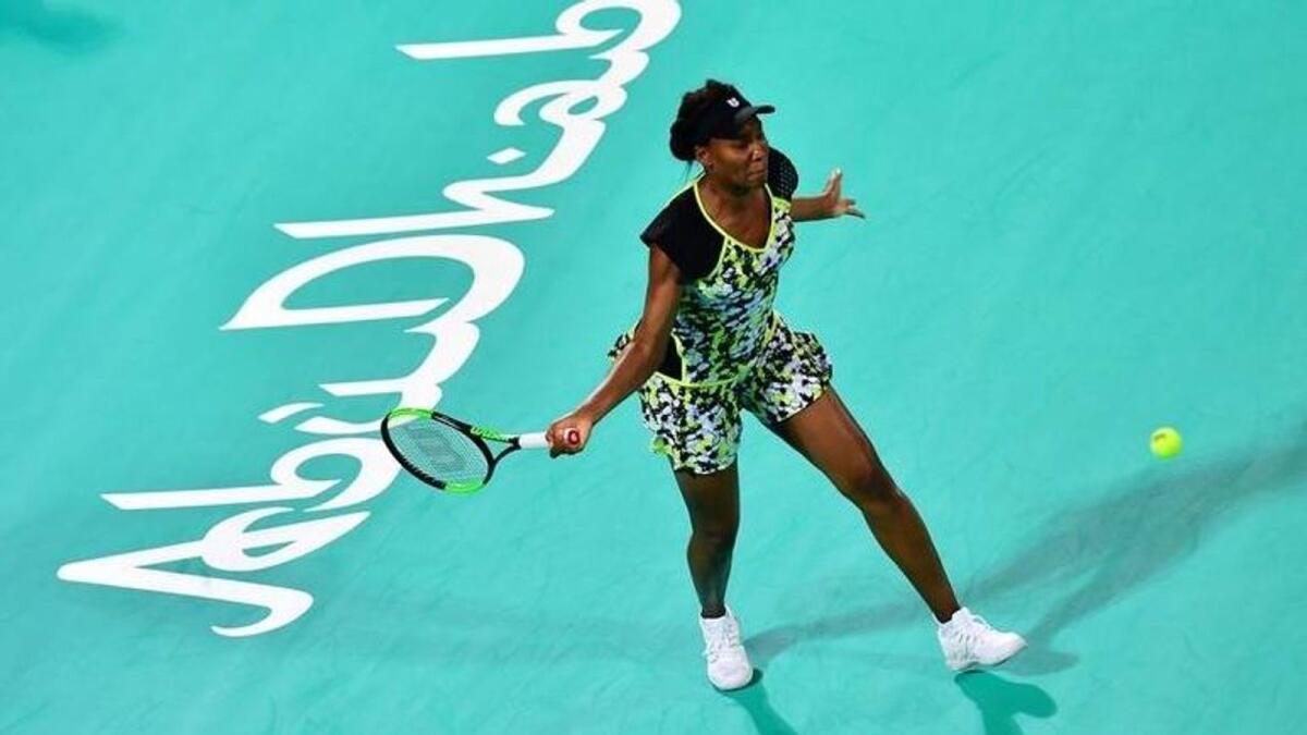 Venus Williams plays a forehand return to Serena Williams during the 2018 Mubadala World Tennis Championship in Abu Dhabi. (AFP file)
