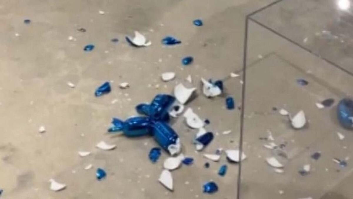 A bystander took a video as gallery employees swept up the glass shards.