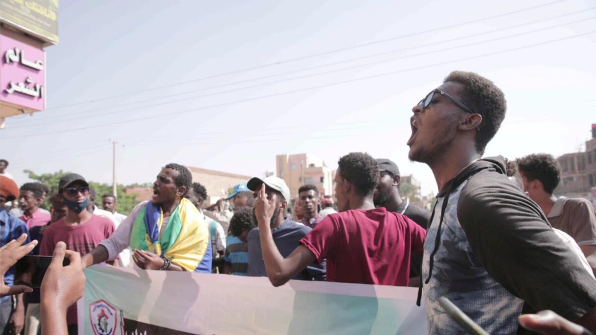 People chant slogans during a protest in Khartoum, amid ongoing demonstrations against a military takeover in Khartoum. — AP