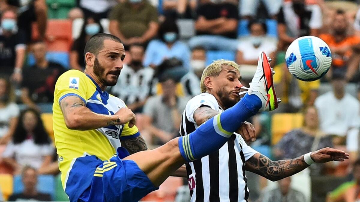 uventus' Leonardo Bonucci in action with Udinese's Roberto Pereyra. — Reuters
