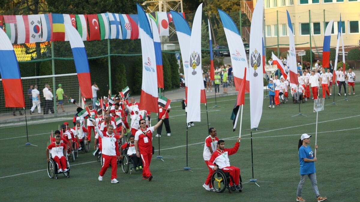 The UAE’s wheelchair Paralympics medallist Mohammed Abdullah Al Hammadi, leads the contingent on to the field at Yonost Stadium in Sochi in the Russian region of Krasnodar, on Sunday evening. 
