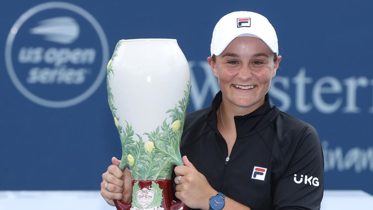 Ashleigh Barty of Australia holds the championship trophy after defeating Jil Teichmann of Switzerland during the women's singles finals of the Western &amp; Southern Open in Mason, Ohio. — AFP