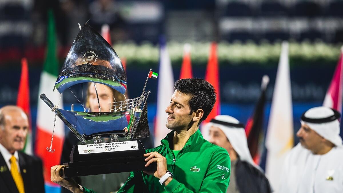 THE CHAMPION: Novak Djokovic celebrates with the Dubai Tennis Championships trophy