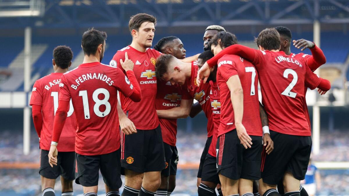 Manchester United's players celebrate a goal against Everton. — Reuters