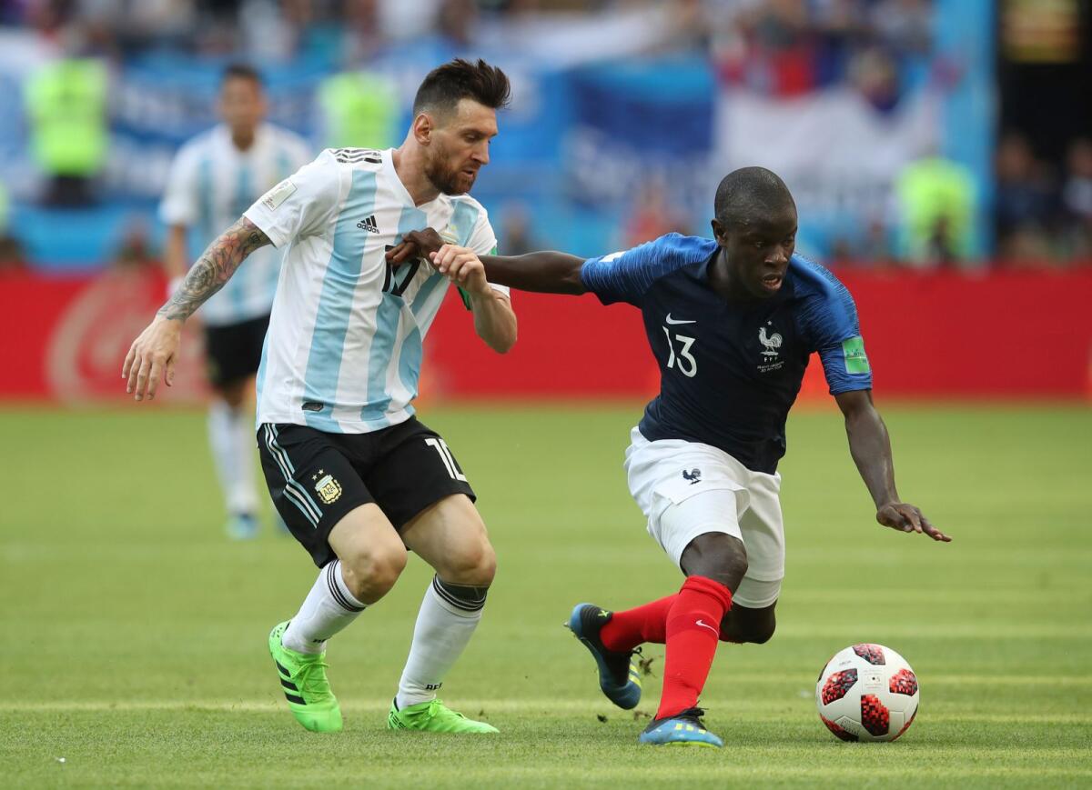 France's Ngolo Kante (right) fends off a challenge from Argentina's Lionel Messi during the round of 16 match between France and Argentina at the 2018 Fifa World Cup in Kazan, Russia. — AP file