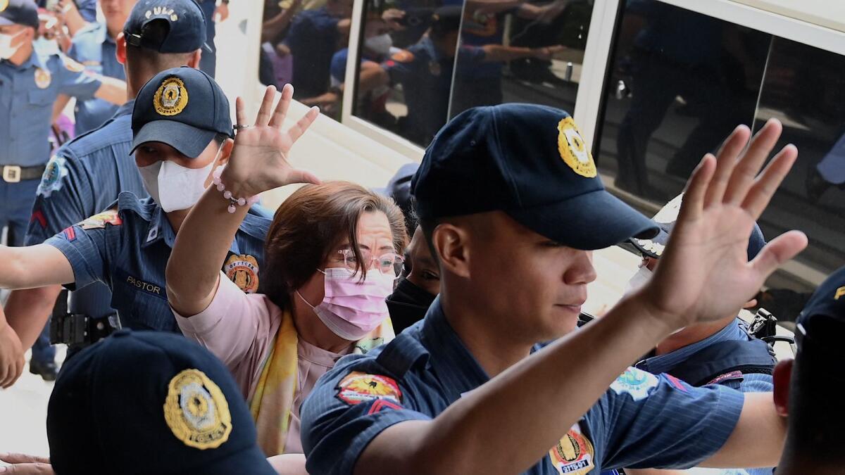 Former Philippine senator and human rights campaigner Leila de Lima waves as she arrives at the Muntinlupa Trial Court in Manila on June 5, 2023.  — AFP