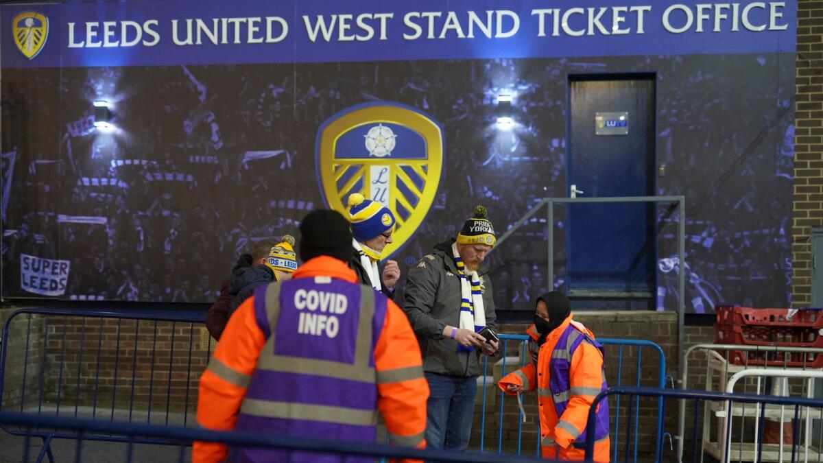 Supporters have their proof of vaccination checked as they go through a Covid checkpoint before the English Premier League match between Leeds United and Arsenal on December 18. (AP)