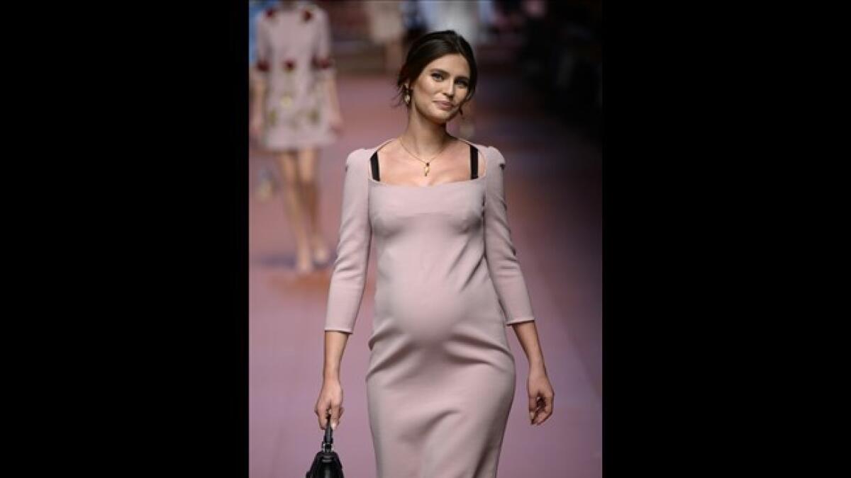 At Dolce and Gabbana's Milan Fashion Week show last year, pregnant Italian model Bianca Balti walked the catwalk in a fitted peach dress showing her bump.