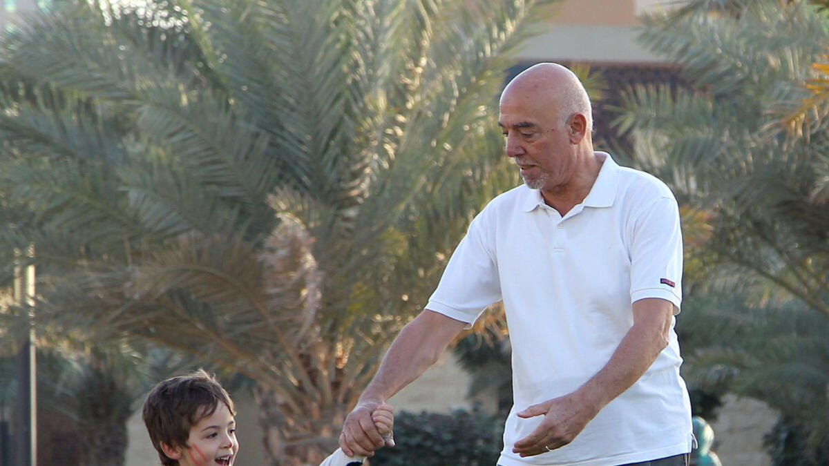 NA030516-MS-HAPPINESS – A grandfather and his grandson playing together at Al Majaz waterfont in Sharjah – Photo by M.Sajjad