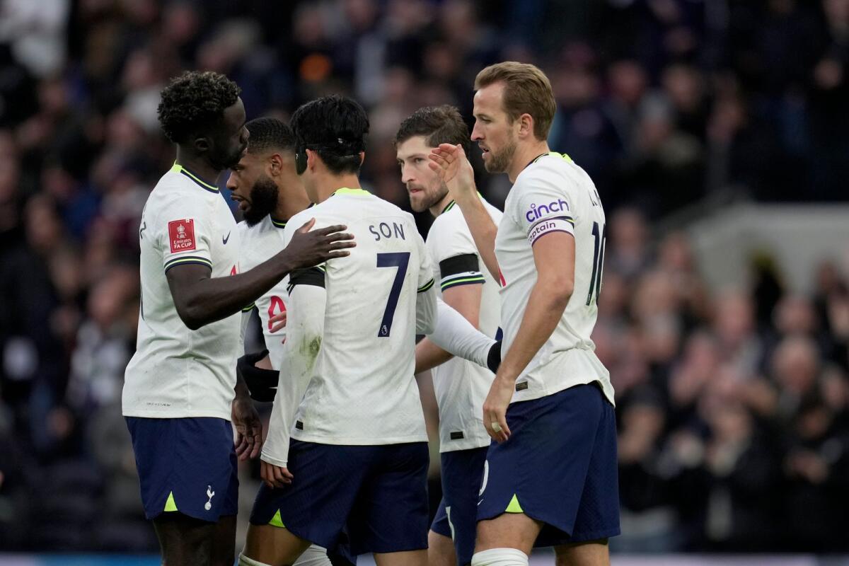 Tottenham's Harry Kane (right) celebrates with teammates after scoring. — AP