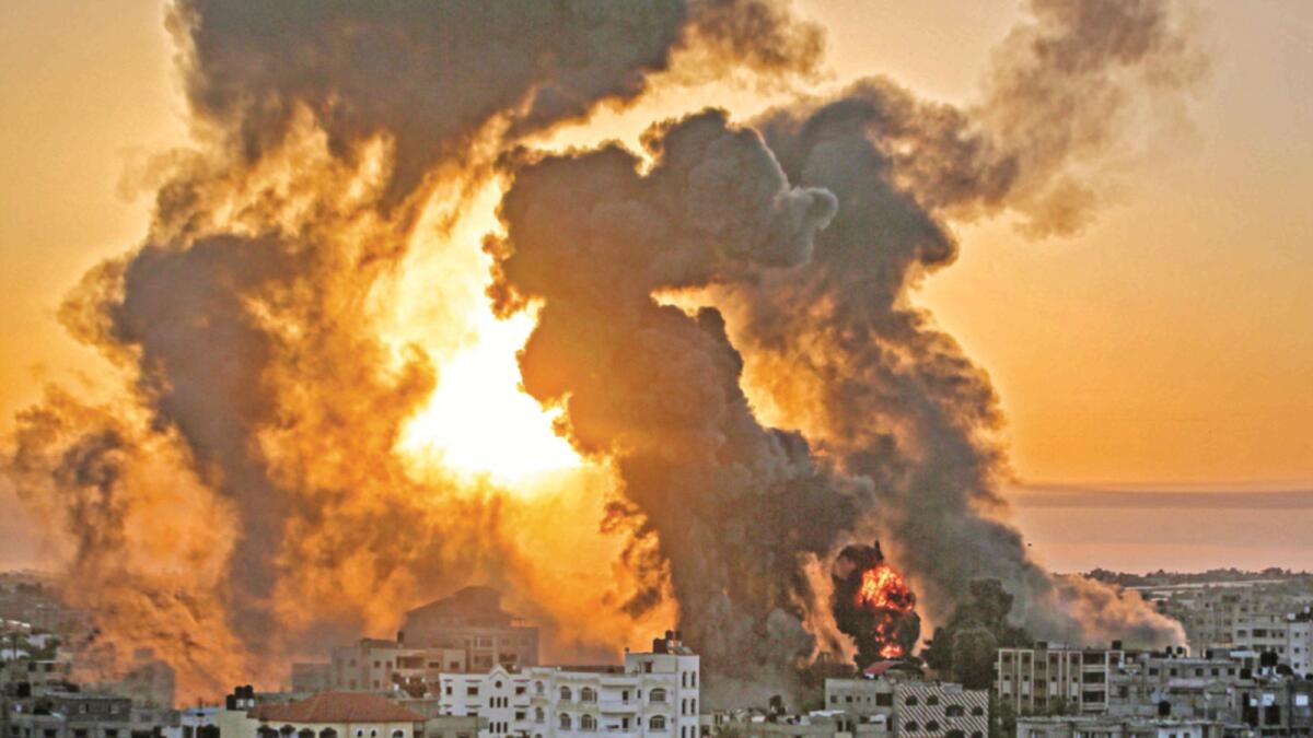 Fire rages in Khan Yunish following an Israeli airstrike on targets in the southern Gaza strip. — AFP