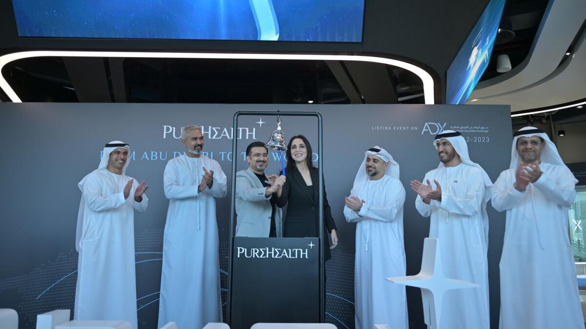 PureHealth and ADX officials ring the bell at the healthcare platform's listing on Wednesday. — Supplied photo