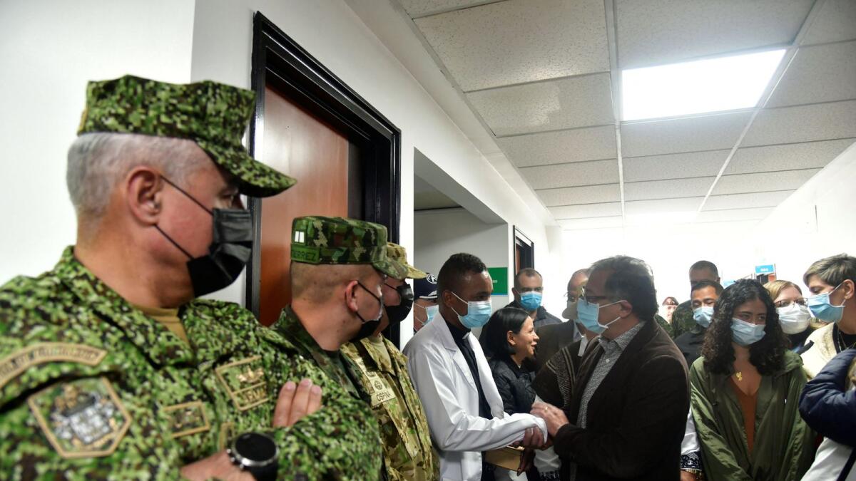 Colombia's President Gustavo Petro greets the doctors who attend to child survivors. Photo: Reuters