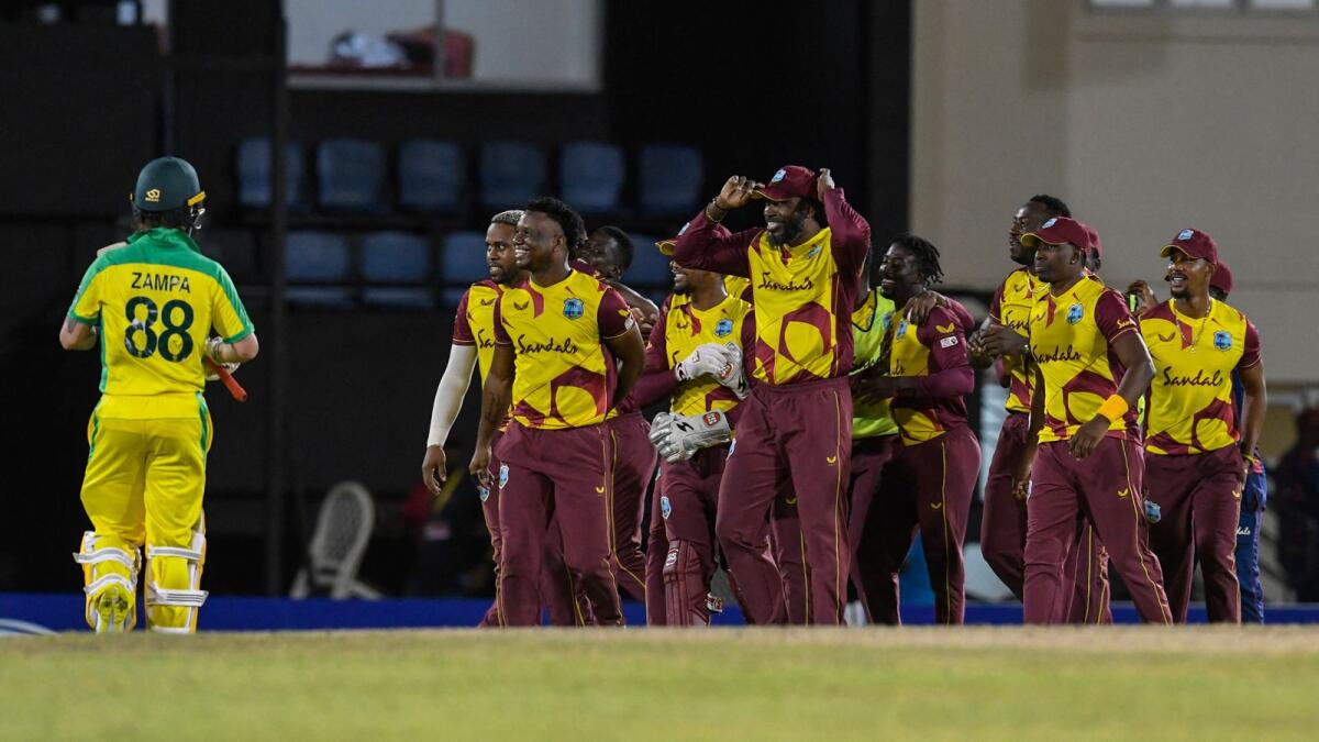 West Indies players celebrate after winning the first T20I against Australia. (AFP)