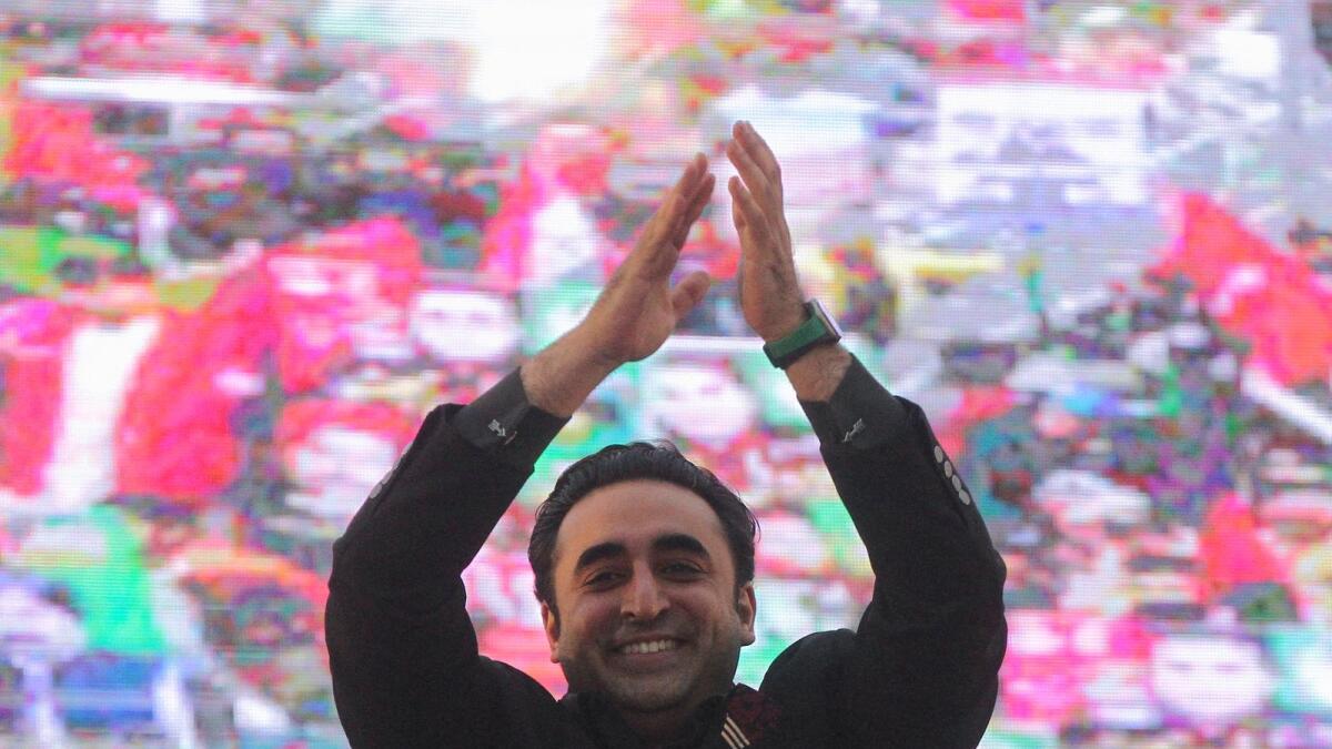 Bilawal Bhutto Zardari waves to supporters during an election campaign in Lahore. — Reuters
