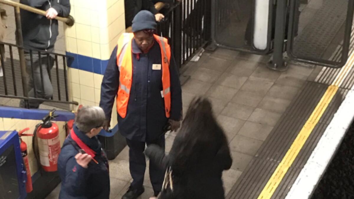London tube shuts down as lady jumps to get her phone 