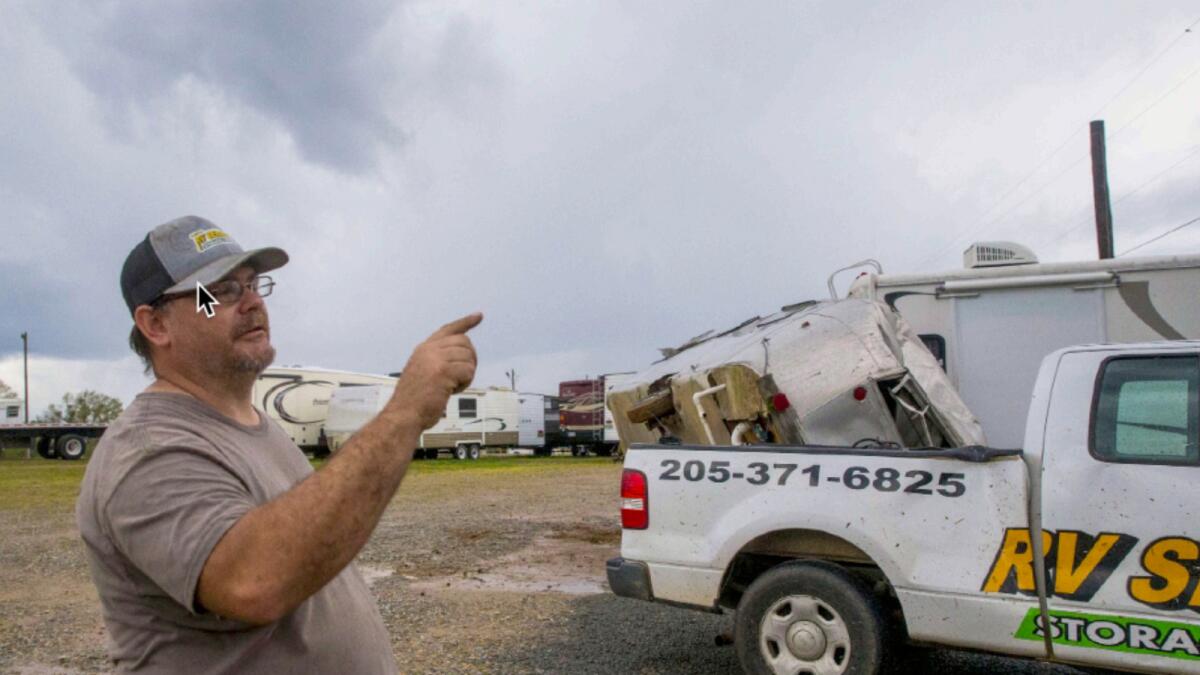 A vehicle technician describes how severe weather destroyed the roof of the workshop while he was inside working in Moundville, Alabama. Photo: AP