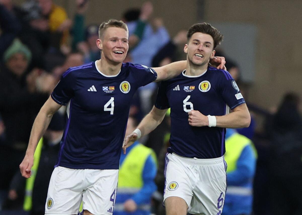 Scotland's Scott McTominay (left) celebrates scoring their second goal. — Reuters
