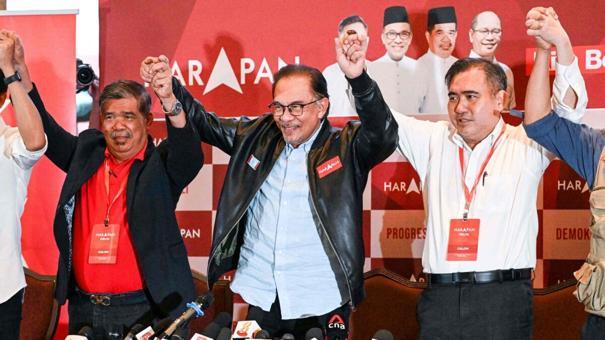 Malaysia's opposition leader Anwar Ibrahim reacts at the end of a press conference in Kuala Lumpur. — AFP