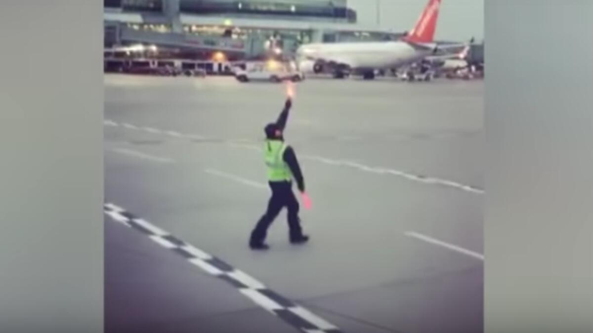 Video: Airline employee dancing on runway goes viral 