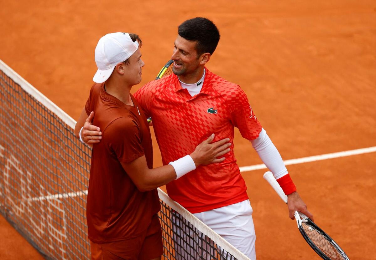 Novak Djokovic congratulates Holger Rune after the match. — Reuters