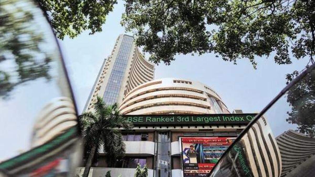 Sensex recovers from days low, still trades 500 points lower 
