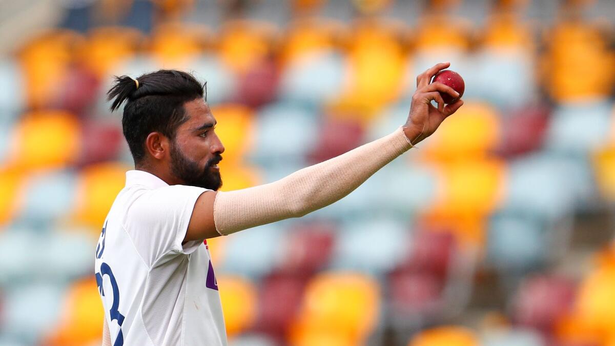Mohammed Siraj gestures with the ball as he leaves the field after taking five wickets. — AP