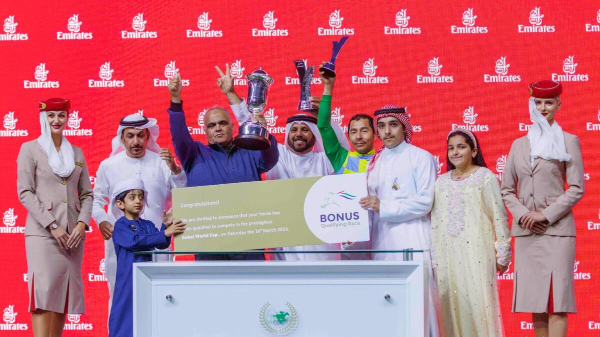 Emirati handler Musabbeh Al Mheiri celebrates with connections after Military Law won the Al Maktoum Classic to earn an invitation to the $12 million Dubai World Cup. - Photo DRC