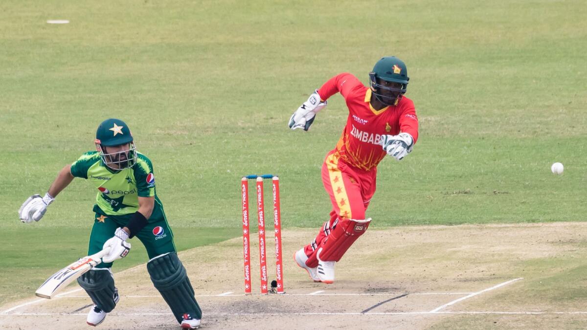 Pakistan's Mohammad Rizwan runs between the wickets as Zimbabwe's wicketkeeper Regis Chakabva fields during the first Twenty20 international. — AFP