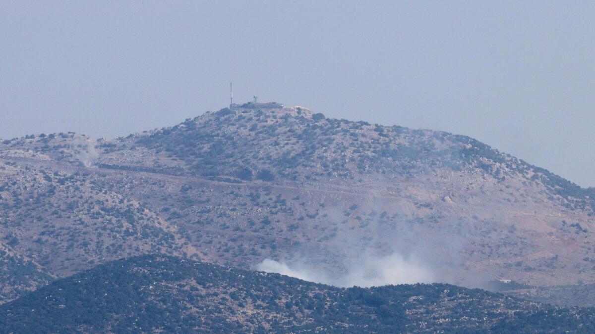 A picture taken from Lebanese town of Marjayoun shows smoke billowing in the contested border area of Shebaa farms on Saturday. — AFP