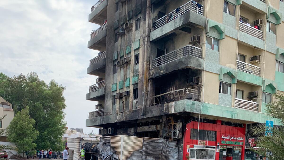 A fire that spread through a nine-storey building on Sheikh Rashid Bin Saeed Street (Old Airport Road) on Sunday afternoon was extinguished and no casualties were reported. Onlookers claimed the fire started from a restaurant on the ground floor and spread upwards. Photo: Ryan Lim/Khaleej Times