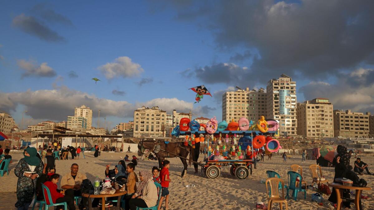 Palestinians gather at the beach in Gaza City  following a ceasefire. Photo: AFP