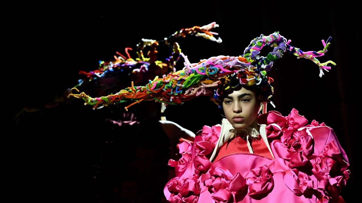 Models present creations from Comme des Garcons Womenswear Fall-Winter 2023-2024 collection (Photo: AFP)