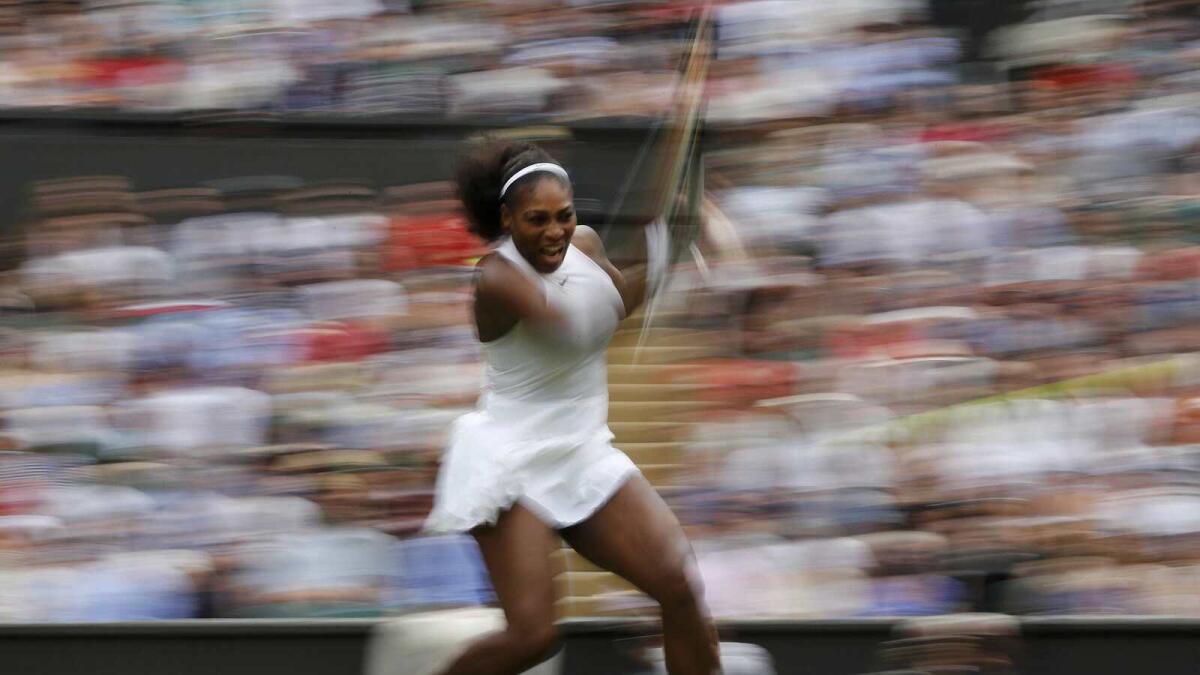 Defending champion Serena, Murray shine on a rainy day