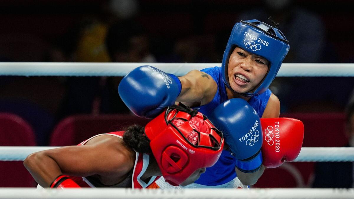 India's Mary Kom (right) during her bout against Ingrit Valencia of Colombia. (PTI)