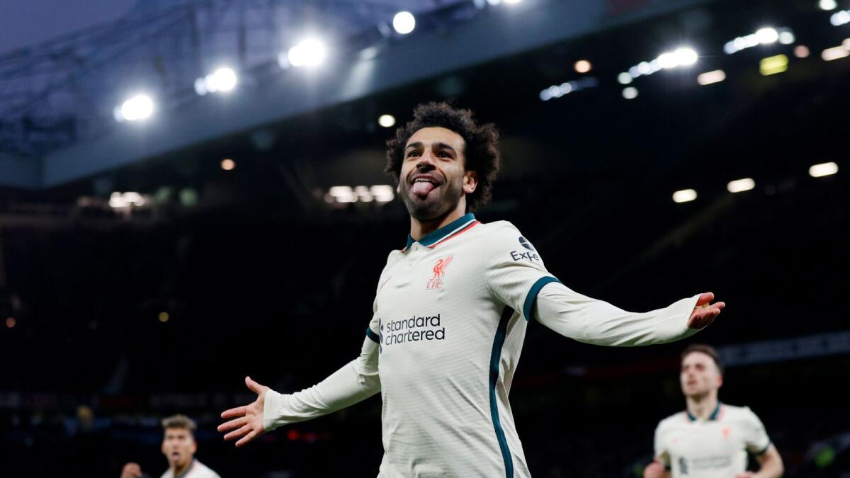 Liverpool's Mohamed Salah celebrates after scoring against Manchester United at Old Trafford on Sunday. — Reuters