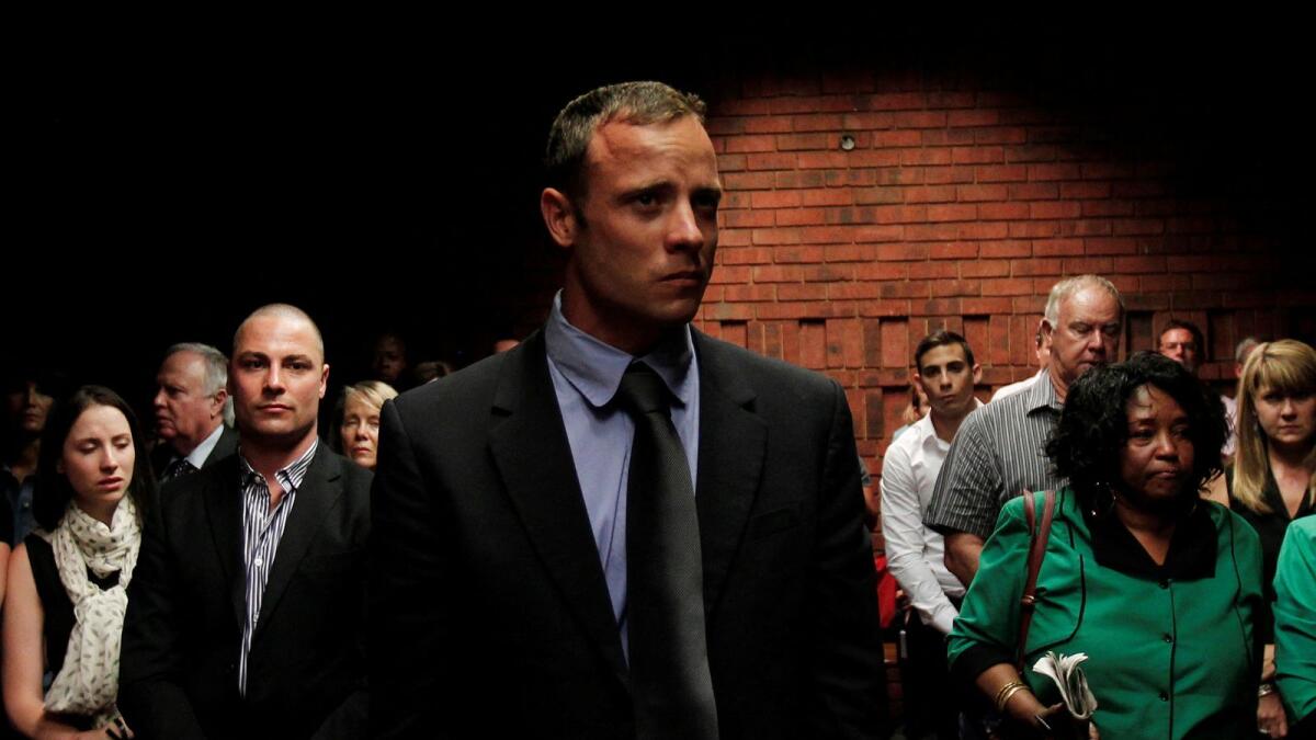 Oscar Pistorius awaits the start of court proceedings in the Pretoria Magistrates court in 2013. — Reuters file