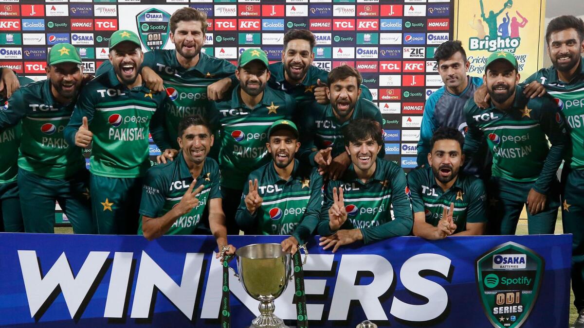 The Pakistan' team pose with the ODI series trophy after the series against West Indies at the Multan Cricket Stadium on Sunday. — AP