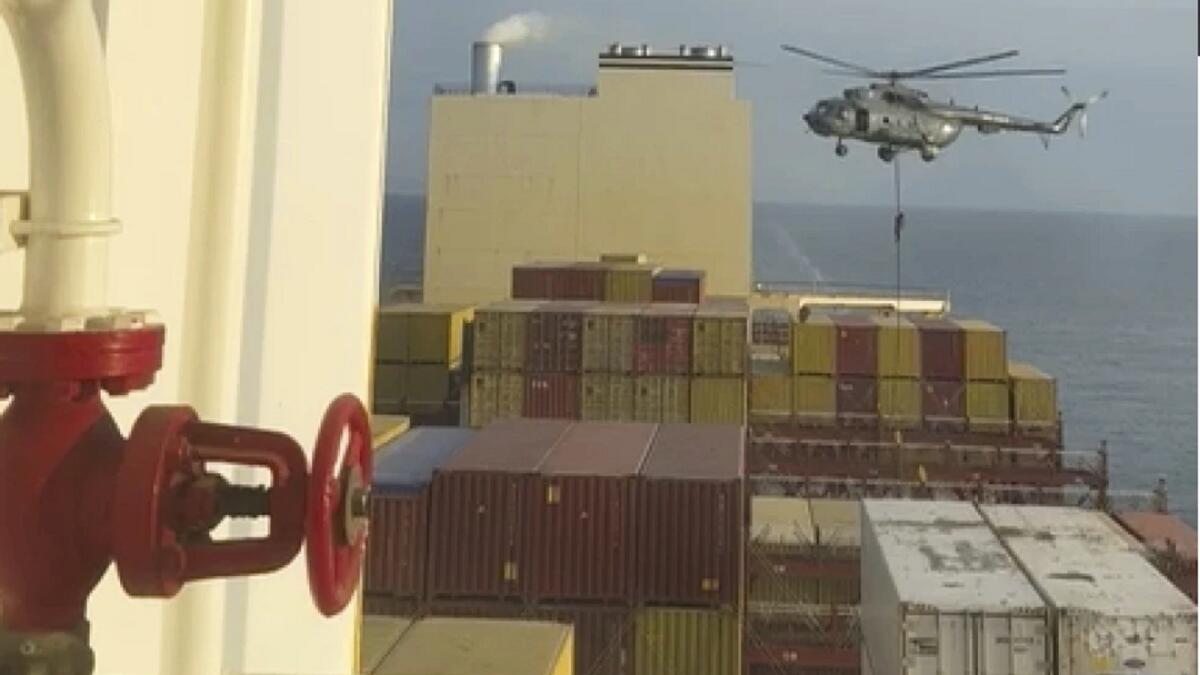 This screengrab from a video provided to the AP shows a helicopter raid targeting a vessel near the Strait of Hormuz on Saturday, April 13. — AP