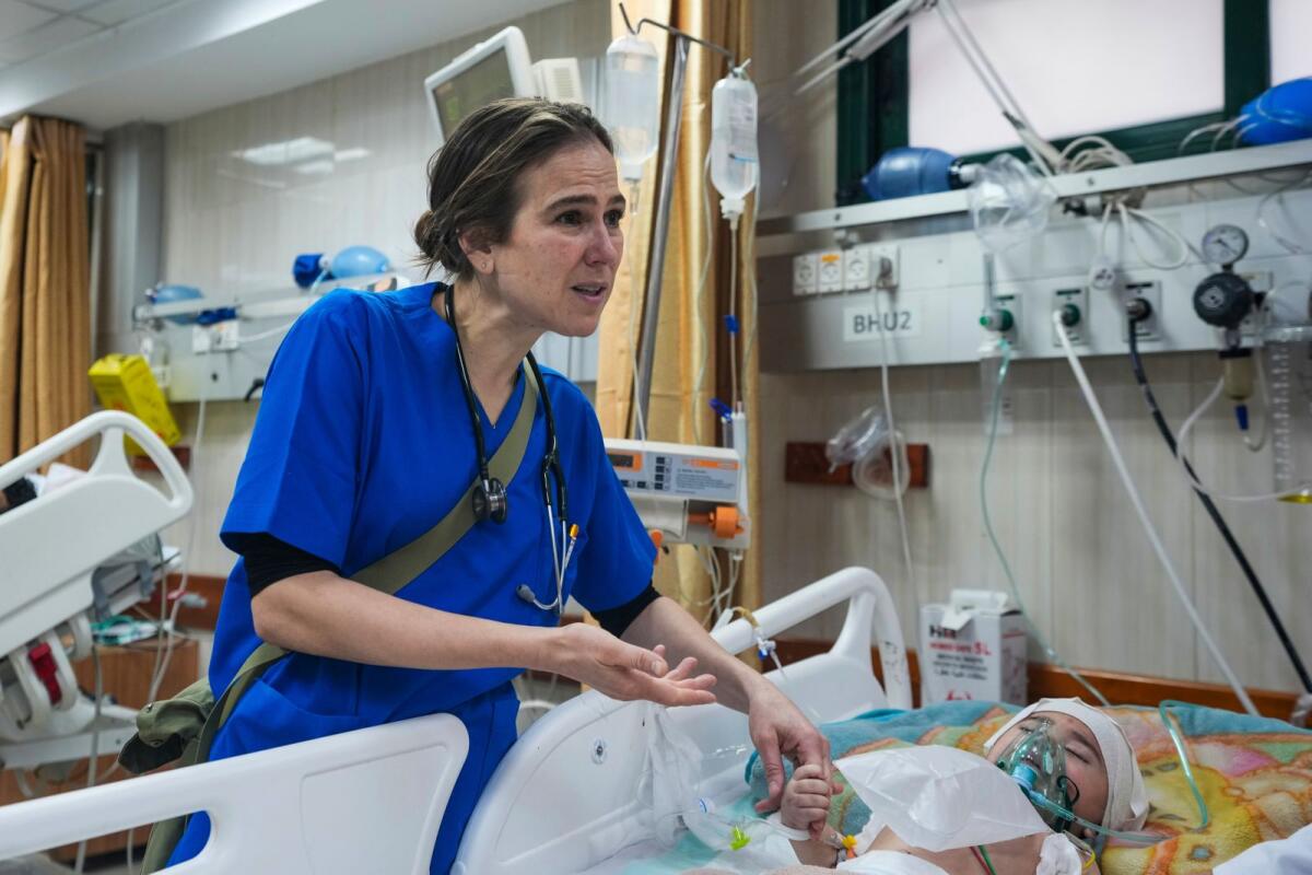 Paediatrician Tanya Haj-Hassan examines wounded Gazan children at Al Aqsa Martyrs Hospital in Deir Al Balah, central Gaza, on March 16, 2024. — AP