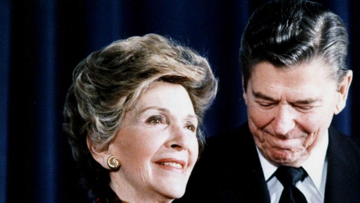 Former  US President Ronald Reagan and First Lady Nancy Reagan in Washington,DC, after she spoke at a White House Conference on 'Drug Free America. - AFP file photo