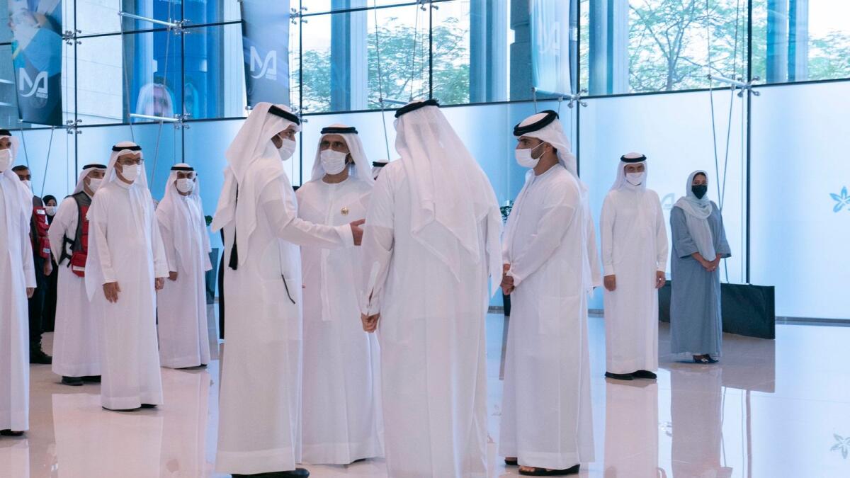 Sheikh Mohammed talks to officials while meeting the teams tasked with managing the emirate’s response to the pandemic. — Twitter