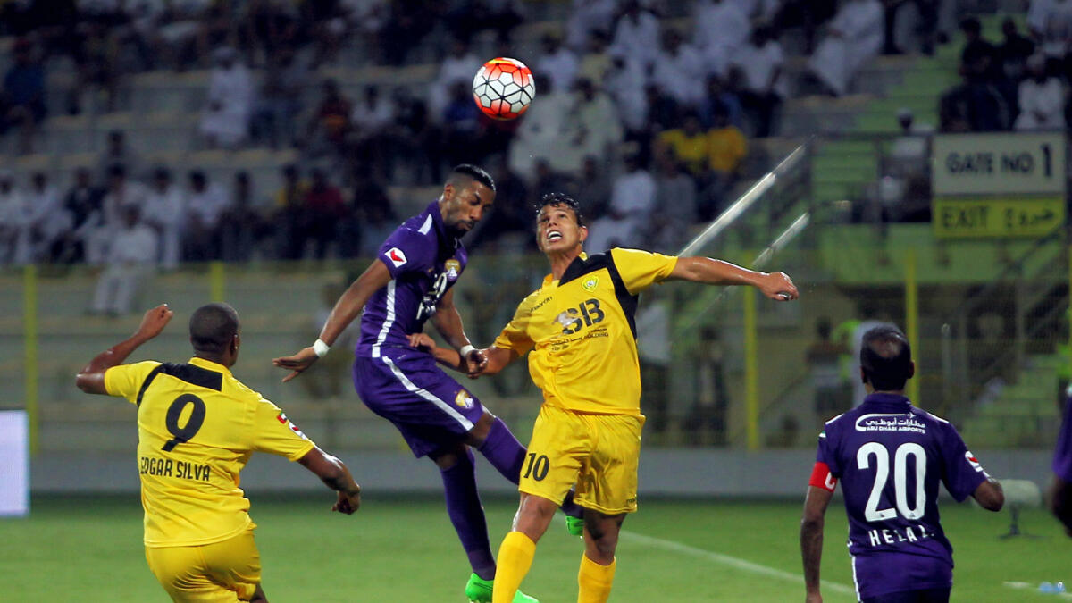 Mohamed Fayez of Al Wasl fights for the ball with Fabio De Lima of Al Ain during an AGL match on September 14. 